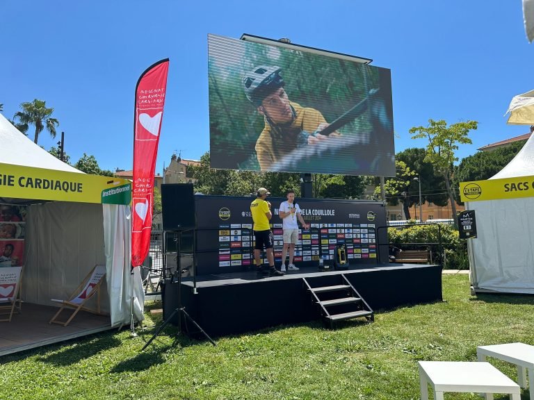 Outdoor LED video wall displaying a live event screen with a large crowd – LED video wall price in India